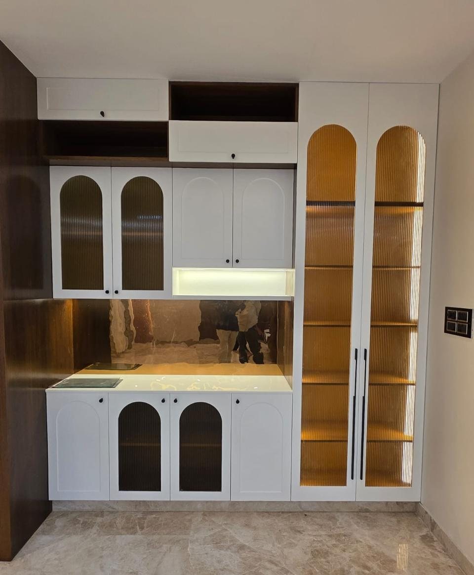 Crockery unit with arched fluted-glass doors and backlit display shelves