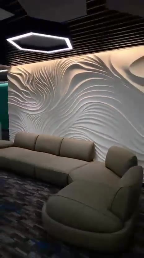 Merlion Builders office: glass cabins, workstations, conference room and a lounge with a sculpted wave wall