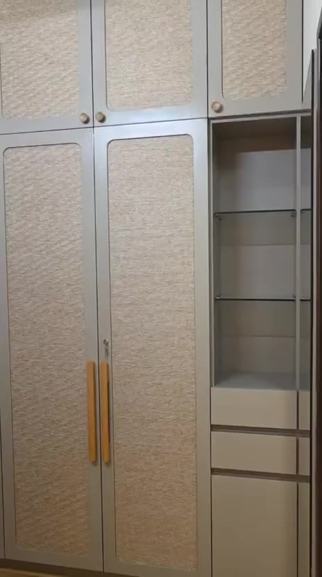 Wardrobes with woven panels and wooden handles